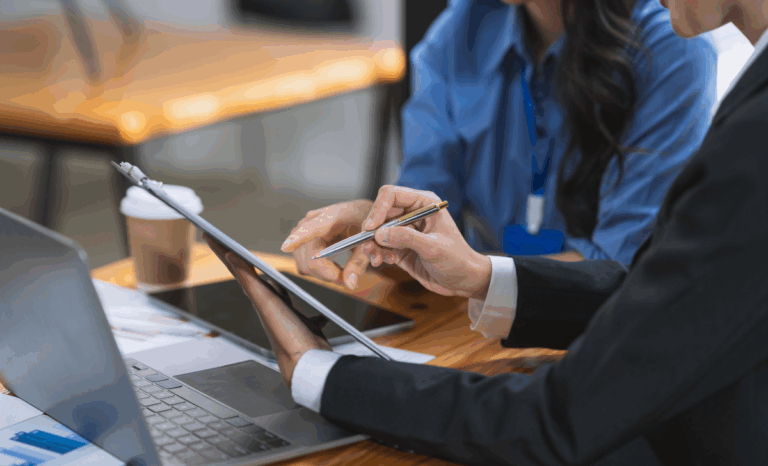 Business professional signing company registration documents related to Thailand corporate compliance rules